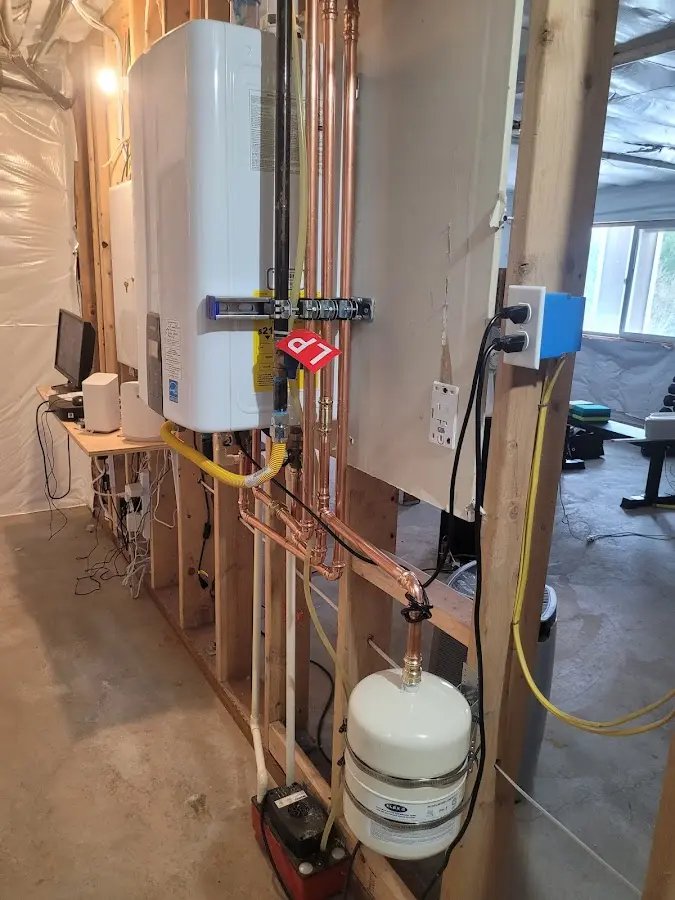 Licensed plumber repairing a kitchen sink in Atlantic